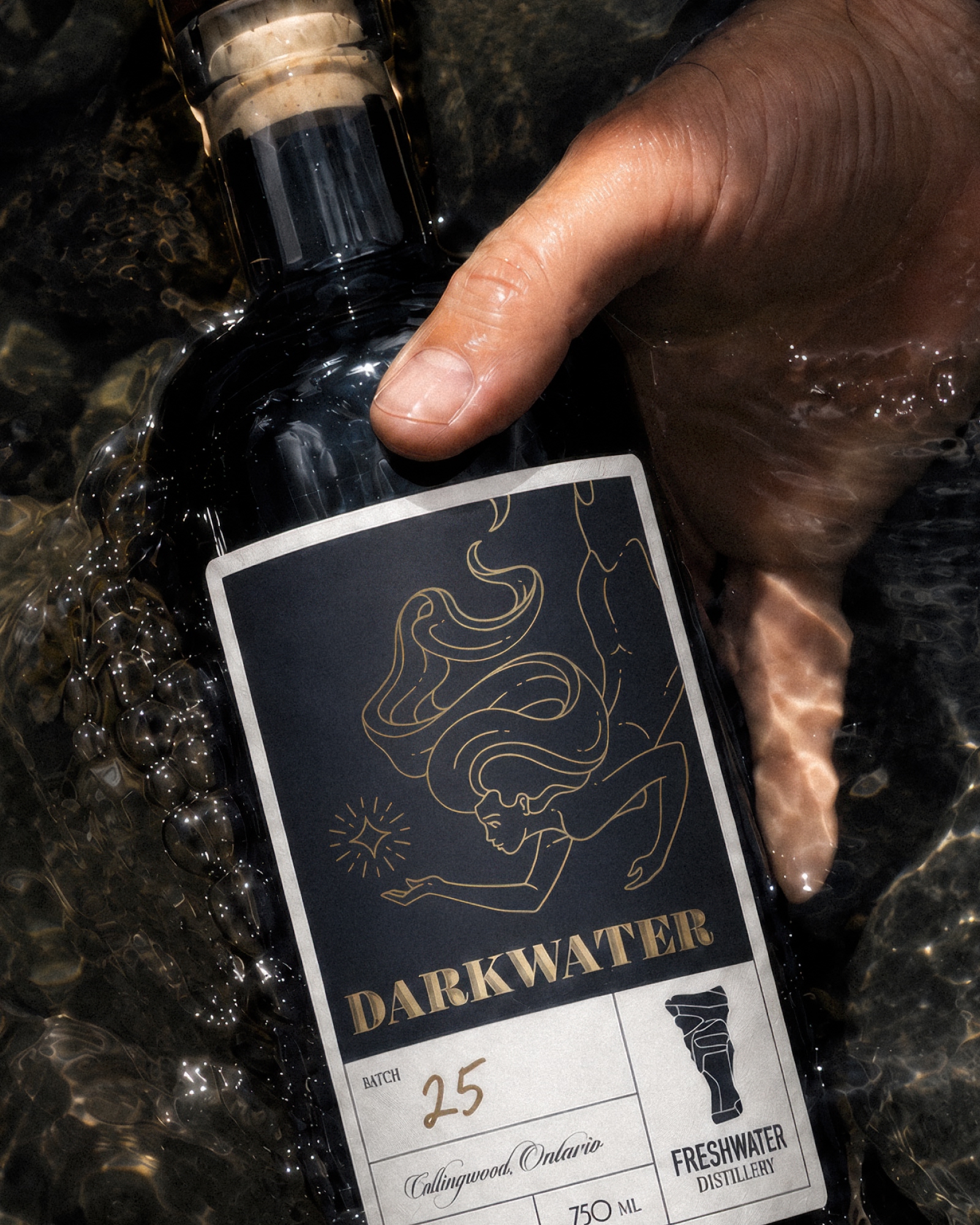 Freshwater Distillery Darkwater bottle featuring the mermaid illustration on its label.