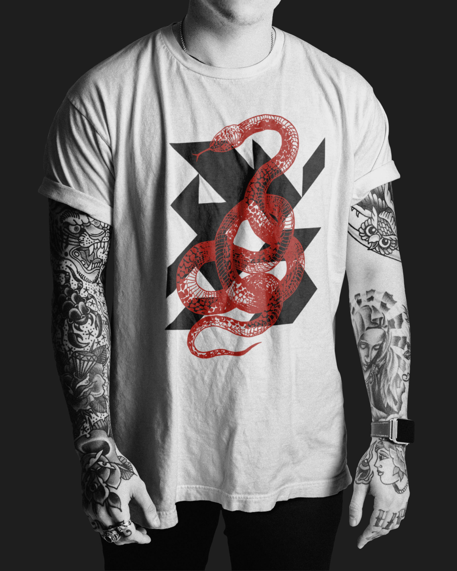 White DVAS T-shirt featuring intertwined snakes layered over geometric logo forms.