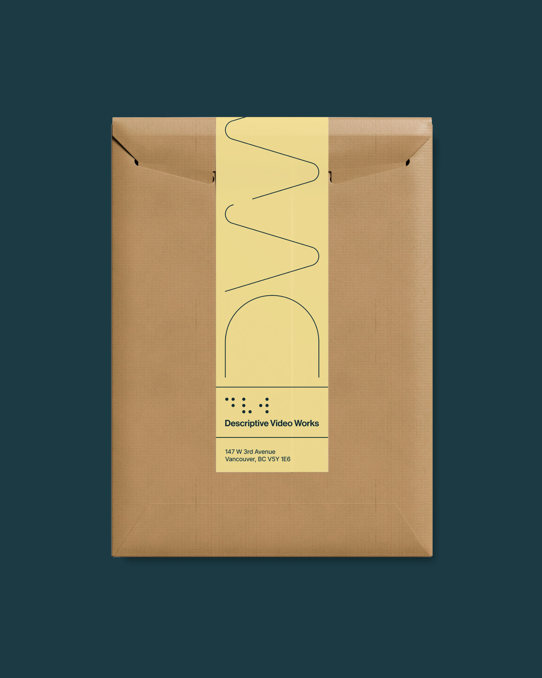 Descriptive Video Works shipping package featuring the waveform graphic and yellow identity system.