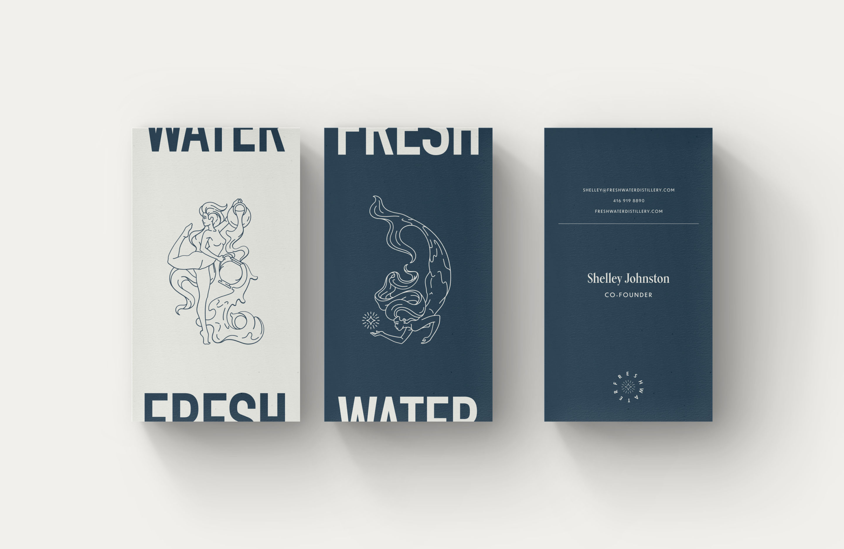 Freshwater Distillery business card designs featuring illustrated Clearwater and Darkwater images.