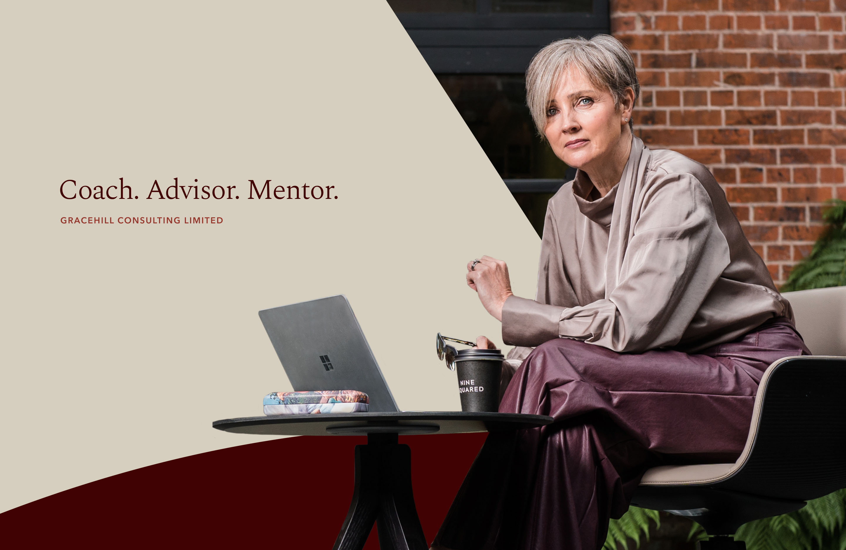 Gracehill Consulting campaign featuring a seated leadership coach and the message “Coach. Advisor. Mentor.”