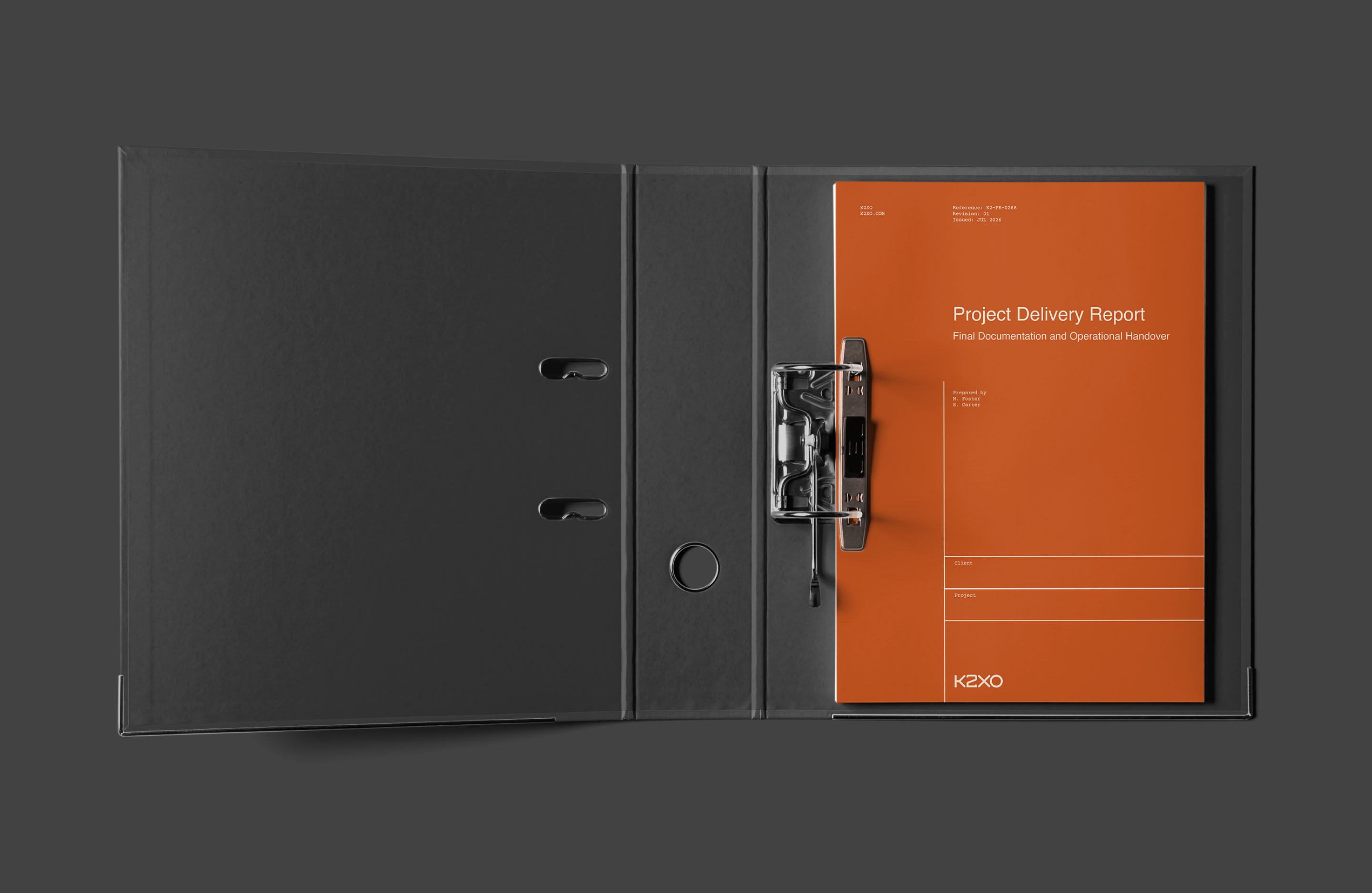 K2XO project delivery report presented inside a black ring binder with orange cover design.