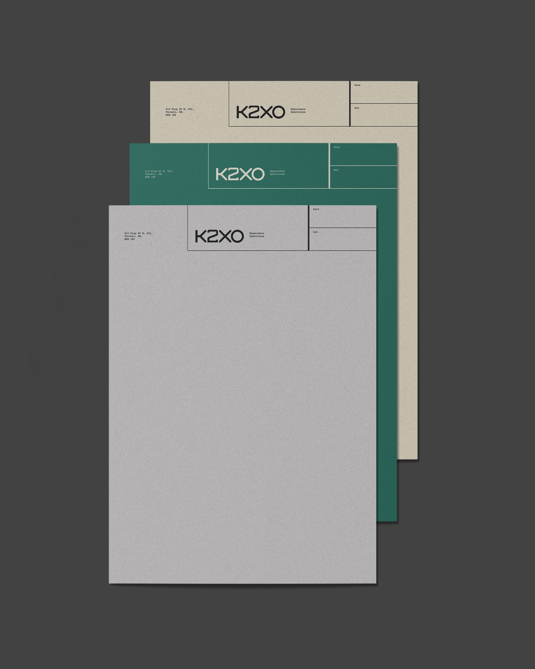 K2XO stationery system featuring letterhead in cream, teal and grey variations.
