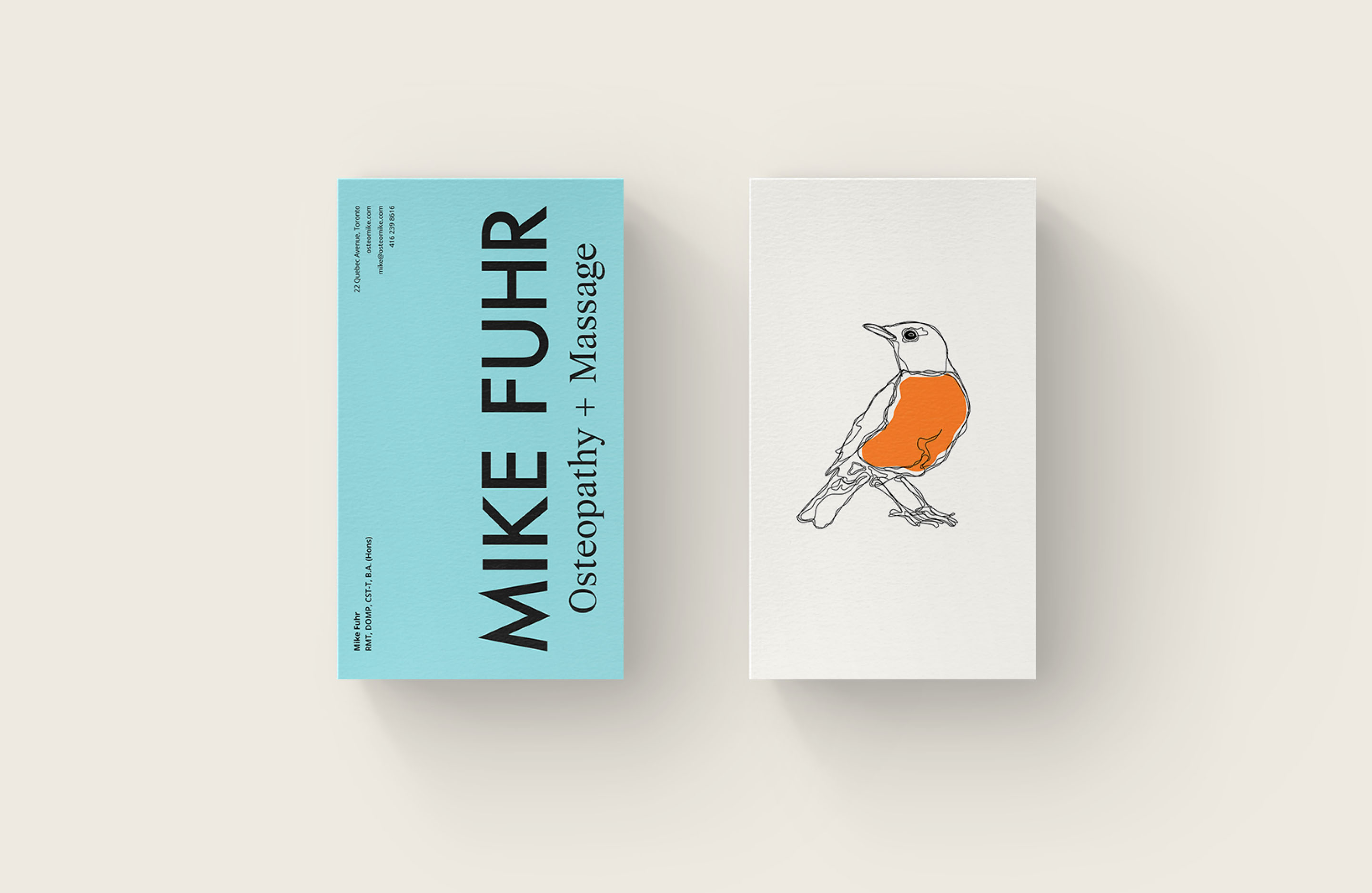 Mike Fuhr business cards featuring robin illustration, bold typography and turquoise and orange brand colours.