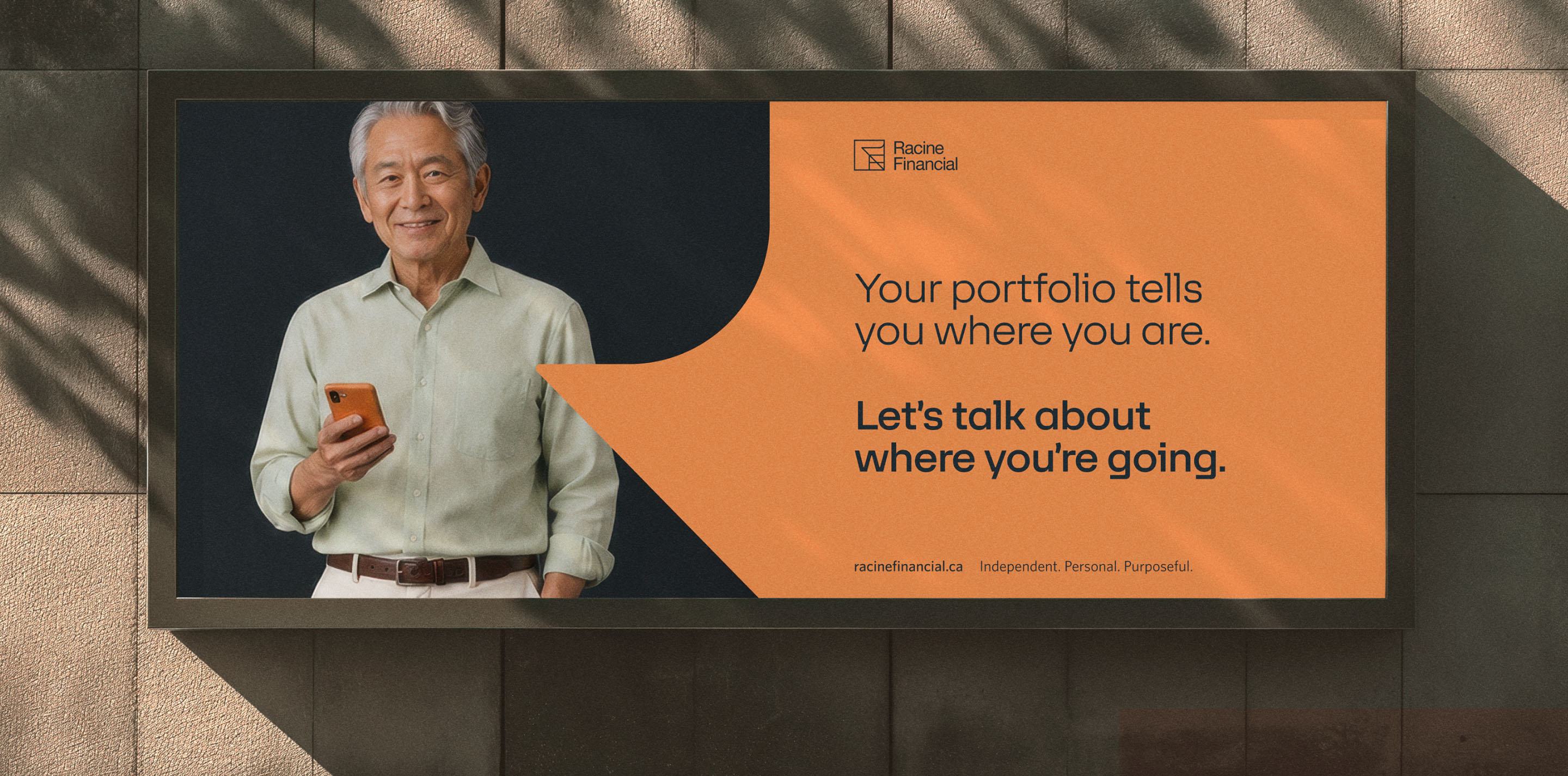 Racine Financial outdoor advertisement featuring a client portrait and the message “Your portfolio tells you where you are. Let’s talk about where you’re going.”